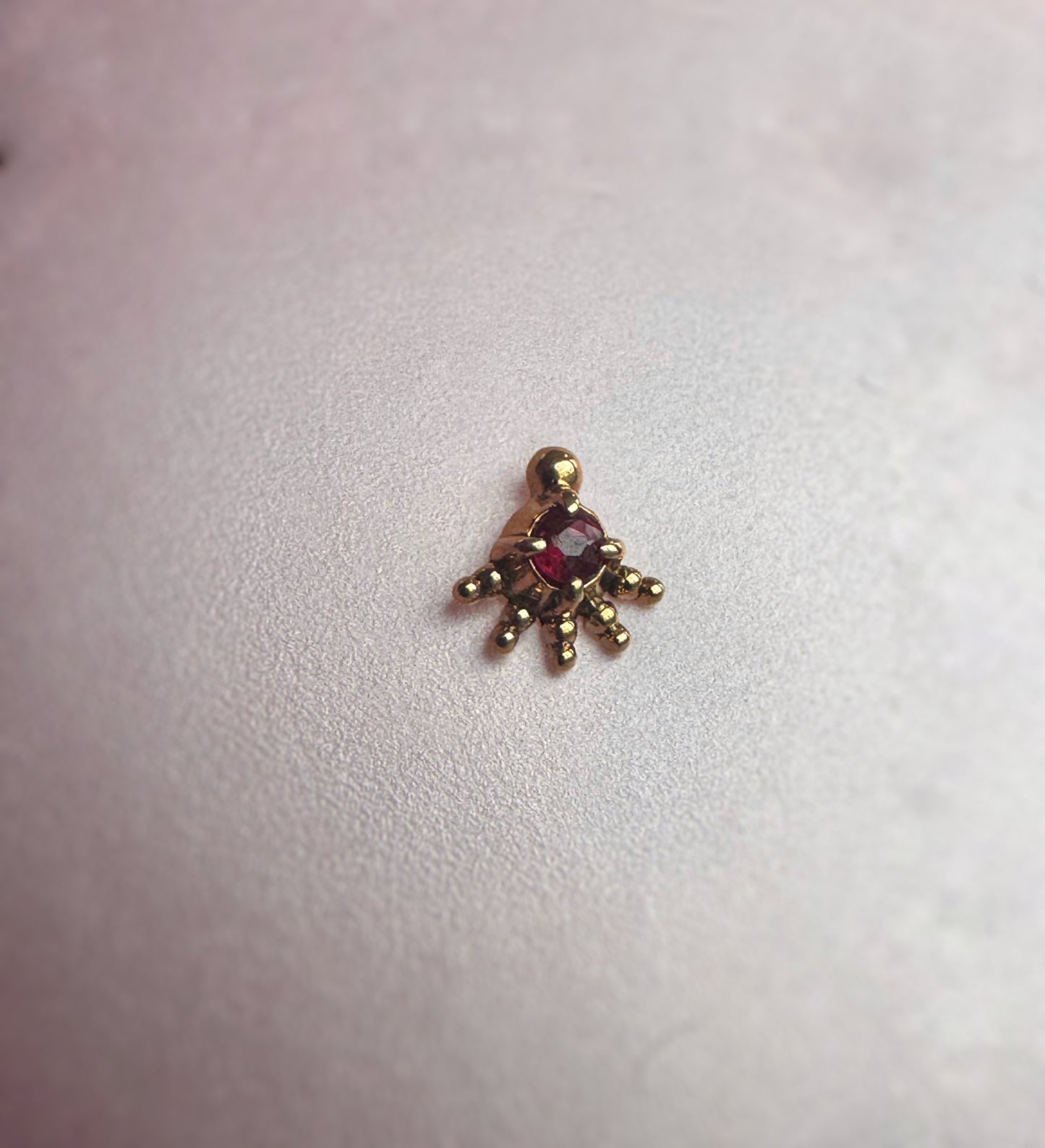 ruby centred gold attachment